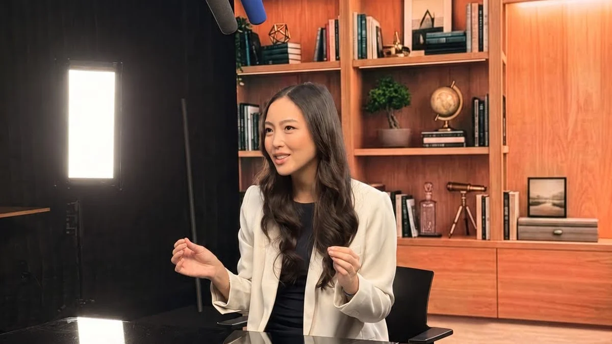 Lorraine K. Lee filming a LinkedIn Learning course on a lit set